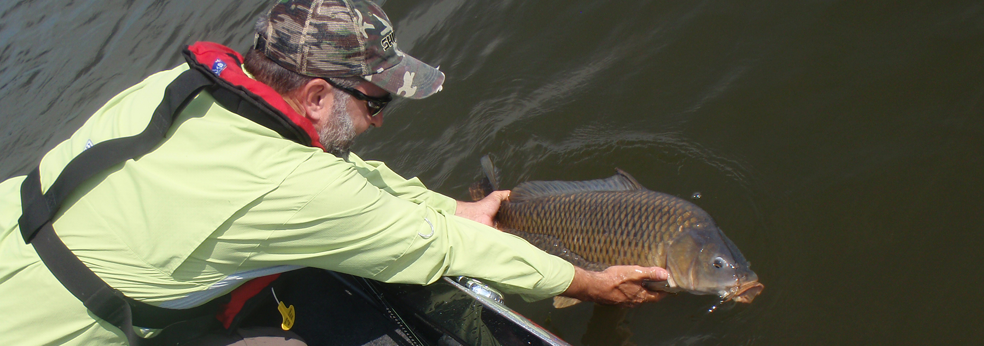 Lawrence releasing a carp